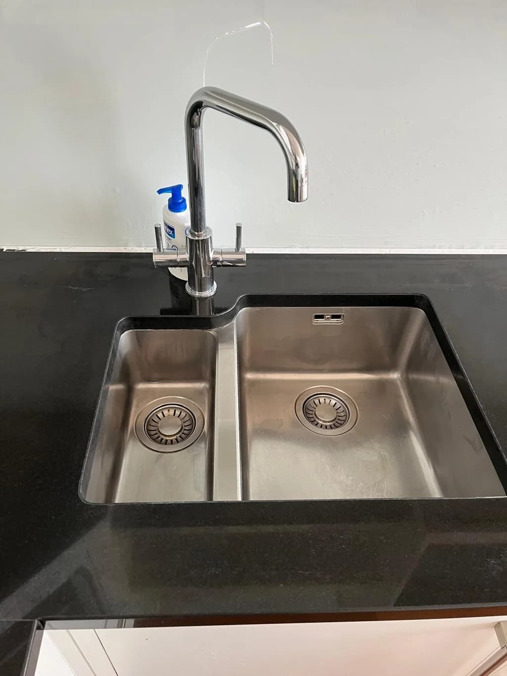 Stainless steel double sink polished bright after a thorough clean
