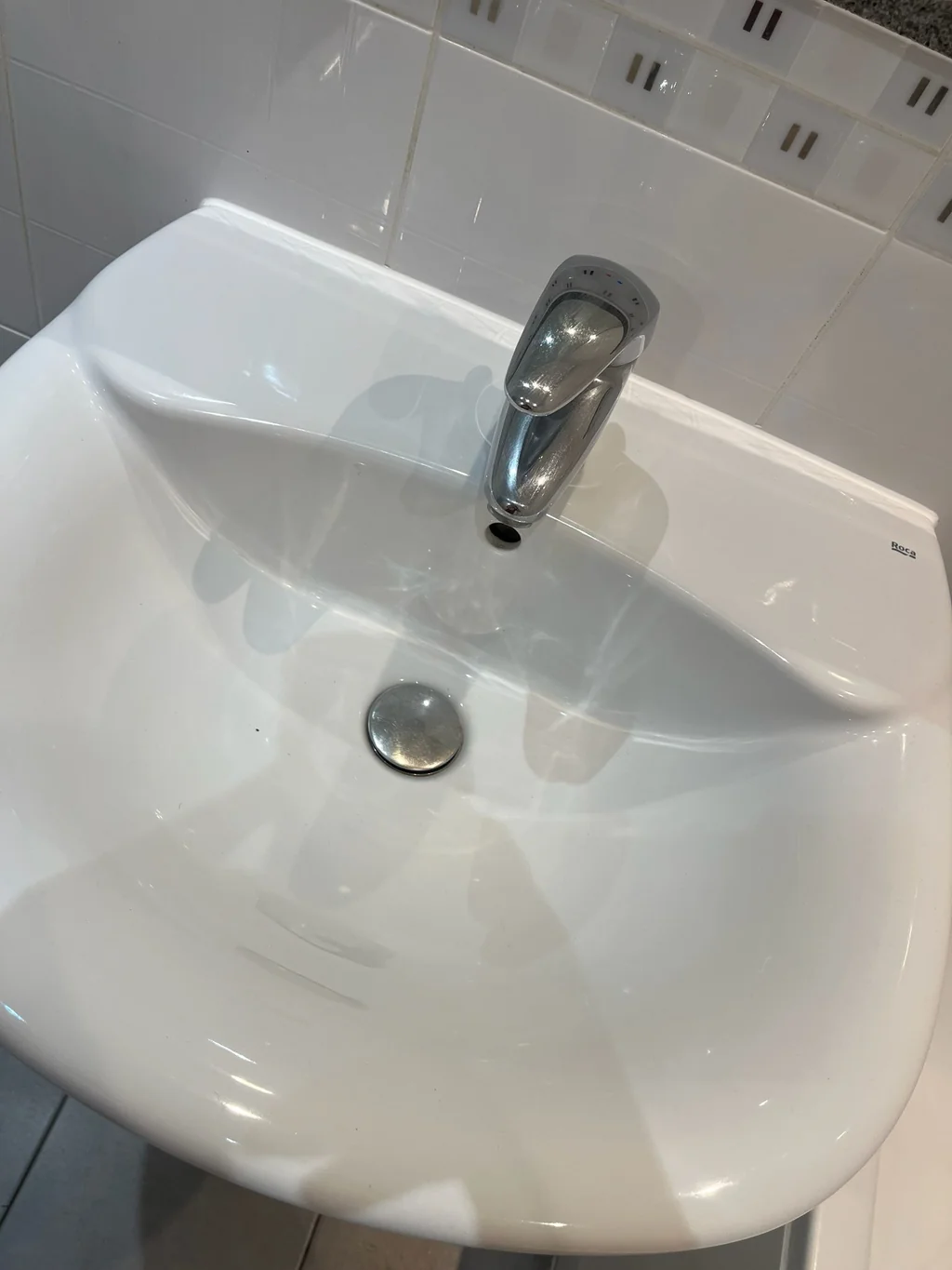 Pedestal basin gleaming after a regular domestic clean
