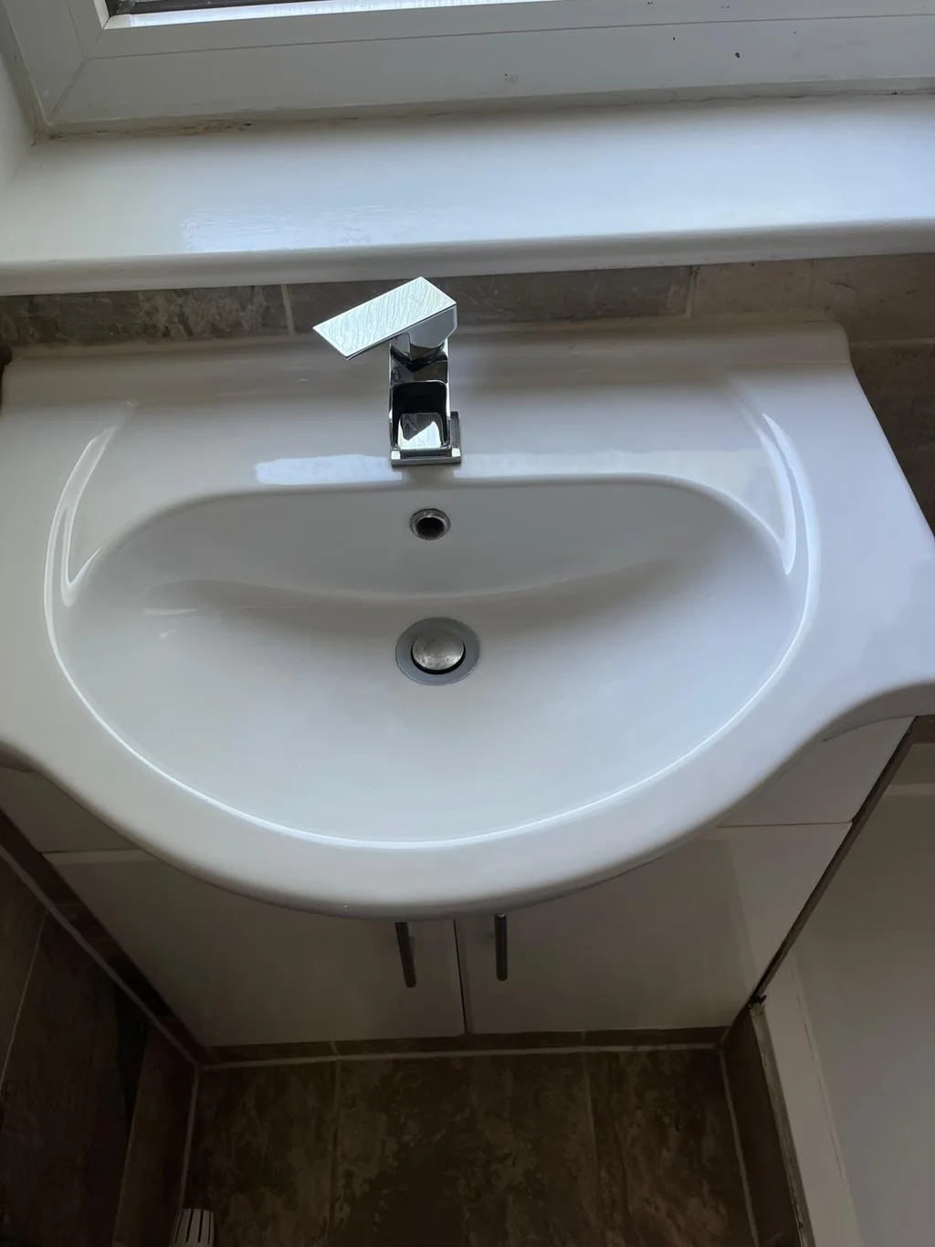 Bathroom basin and vanity spotless for a move-in clean